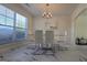 Dining room with neutral paint and modern chandelier at 771 Franklin Mill Trce, Loganville, GA 30052