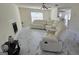 Spacious living room featuring white tile and a white sectional couch at 771 Franklin Mill Trce, Loganville, GA 30052