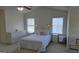 Bright main bedroom featuring a ceiling fan, ample lighting, and neutral decor at 771 Franklin Mill Trce, Loganville, GA 30052