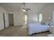 Large main bedroom boasts natural light, fan, and an attached closet at 771 Franklin Mill Trce, Loganville, GA 30052
