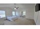 Spacious main bedroom with ceiling fan and adjoining office area at 771 Franklin Mill Trce, Loganville, GA 30052