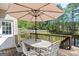 Back deck featuring an outdoor table with seating, overlooking a yard at 2515 Harbins Mill Dr, Dacula, GA 30019