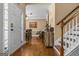 Home entryway with hardwood floors, decorative stained glass, and dining area view at 2515 Harbins Mill Dr, Dacula, GA 30019