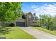 Well-maintained home featuring stone accents, a two-car garage, and an ample driveway at 2515 Harbins Mill Dr, Dacula, GA 30019