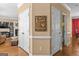 Hallway with decorative southern themed sign, two closets, and access to a living room and dining area at 2515 Harbins Mill Dr, Dacula, GA 30019
