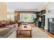 Comfortable living room with fireplace, large window, and plush seating for relaxation and entertainment at 2515 Harbins Mill Dr, Dacula, GA 30019
