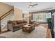 Cozy living room featuring comfortable seating, a fireplace, and plenty of natural light at 2515 Harbins Mill Dr, Dacula, GA 30019