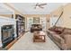Inviting living room with fireplace, bookshelf, and neutral walls providing a relaxing atmosphere at 2515 Harbins Mill Dr, Dacula, GA 30019