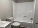 Practical bathroom features a new tub, toilet and sink for a clean and functional space at 300 Wood Rd., Hampton, GA 30228