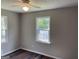 Bright and airy room featuring wood flooring and a view of the outdoors, perfect for relaxation at 300 Wood Rd., Hampton, GA 30228