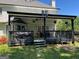 A shaded deck features a grill and ceiling fans, perfect for outdoor dining or entertaining at 1164 Interlaken Pass, Jonesboro, GA 30238