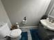 Small bathroom with decorative vessel sink and new toilet at 1164 Interlaken Pass, Jonesboro, GA 30238