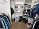 Walk-in closet featuring built-in shelving and clothing rods at 1164 Interlaken Pass, Jonesboro, GA 30238