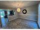 Bright dining room with modern lighting, view to kitchen, and light gray paint at 1164 Interlaken Pass, Jonesboro, GA 30238