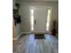 Inviting entryway with light gray flooring and a white front door with glass sidelights at 1164 Interlaken Pass, Jonesboro, GA 30238