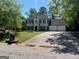 Traditional two-story home with an attached two car garage and driveway at 1164 Interlaken Pass, Jonesboro, GA 30238