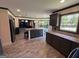 Spacious kitchen with island seating, gray cabinets, granite countertops, and stainless appliances at 1164 Interlaken Pass, Jonesboro, GA 30238