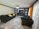 Cozy living room showcasing tile floors, a modern fireplace, and a built-in entertainment center at 1164 Interlaken Pass, Jonesboro, GA 30238
