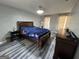 Bright main bedroom featuring dark wood furnishings, and an updated floor at 1164 Interlaken Pass, Jonesboro, GA 30238