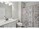 Bright bathroom showcasing a vanity with sink and a tub with patterned shower curtain at 375 Crider Ct, Woodstock, GA 30188
