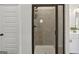 Modern bathroom featuring a walk-in shower with glass doors and sleek fixtures at 375 Crider Ct, Woodstock, GA 30188