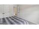 Neutral bedroom with a soft comforter and a view into another room at 375 Crider Ct, Woodstock, GA 30188