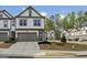 Charming townhouse with a two-car garage and well-maintained landscaping at 375 Crider Ct, Woodstock, GA 30188