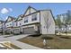 Beautiful townhome with attached garage and a well-maintained landscaped front yard at 375 Crider Ct, Woodstock, GA 30188