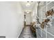 Bright hallway with a decorative rug, stylish console table, and an inviting wreath at 375 Crider Ct, Woodstock, GA 30188