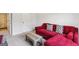 Cozy living room features a red sofa and stylish coffee table, perfect for relaxation at 375 Crider Ct, Woodstock, GA 30188