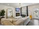 Cozy living room with fireplace, TV, and lots of natural light at 375 Crider Ct, Woodstock, GA 30188