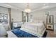 Luxurious main bedroom with plush carpeting, tray ceiling, and elegant chandelier at 375 Crider Ct, Woodstock, GA 30188