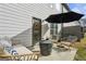 Cozy outdoor patio with comfortable seating and shaded umbrella for relaxing at 375 Crider Ct, Woodstock, GA 30188