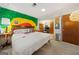 Bedroom featuring unique mural, natural light, and neutral carpet at 2406 Redfield Dr, Norcross, GA 30071