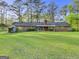 Expansive backyard featuring a well-maintained lawn and a brick house at 242 Hickory Rd, Fayetteville, GA 30214