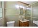 Bathroom featuring a shower with glass doors and a vanity with a sink at 242 Hickory Rd, Fayetteville, GA 30214