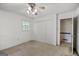 Bedroom with neutral walls and a large closet featuring plush carpet flooring at 242 Hickory Rd, Fayetteville, GA 30214