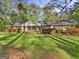 Charming brick ranch home with manicured landscaping, a welcoming entrance, and a sprawling lawn at 242 Hickory Rd, Fayetteville, GA 30214