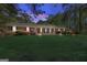 Inviting brick home with lush landscaping in the front yard at 242 Hickory Rd, Fayetteville, GA 30214