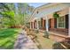 Covered front porch with brick columns and colorful plants at 242 Hickory Rd, Fayetteville, GA 30214