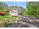 Single story brick home with an attached two car garage, private driveway at 242 Hickory Rd, Fayetteville, GA 30214