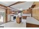 Traditional eat-in kitchen featuring wood cabinets, laminate counters and a center island at 242 Hickory Rd, Fayetteville, GA 30214