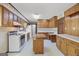 Traditional eat-in kitchen featuring wood cabinets, laminate counters and a center island at 242 Hickory Rd, Fayetteville, GA 30214