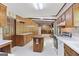 Traditional eat-in kitchen featuring wood cabinets, laminate counters and a center island at 242 Hickory Rd, Fayetteville, GA 30214