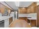 Traditional eat-in kitchen featuring wood cabinets, laminate counters and a center island at 242 Hickory Rd, Fayetteville, GA 30214