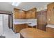Traditional eat-in kitchen featuring wood cabinets, laminate counters and a center island at 242 Hickory Rd, Fayetteville, GA 30214
