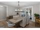 Elegant dining room with stylish chandelier and sliding doors to the backyard, perfect for entertaining at 319 S Mount Carmel Rd, Mcdonough, GA 30253