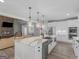 Stylish kitchen features a large center island, modern appliances, and ample cabinet space at 319 S Mount Carmel Rd, Mcdonough, GA 30253