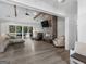 Spacious living room showcases a statement fireplace, vaulted ceilings, and luxury vinyl flooring at 319 S Mount Carmel Rd, Mcdonough, GA 30253
