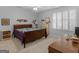 Cozy bedroom with a wooden bed frame, neutral walls, carpet, and window with shutters at 307 Gladstone Dr, Mcdonough, GA 30253